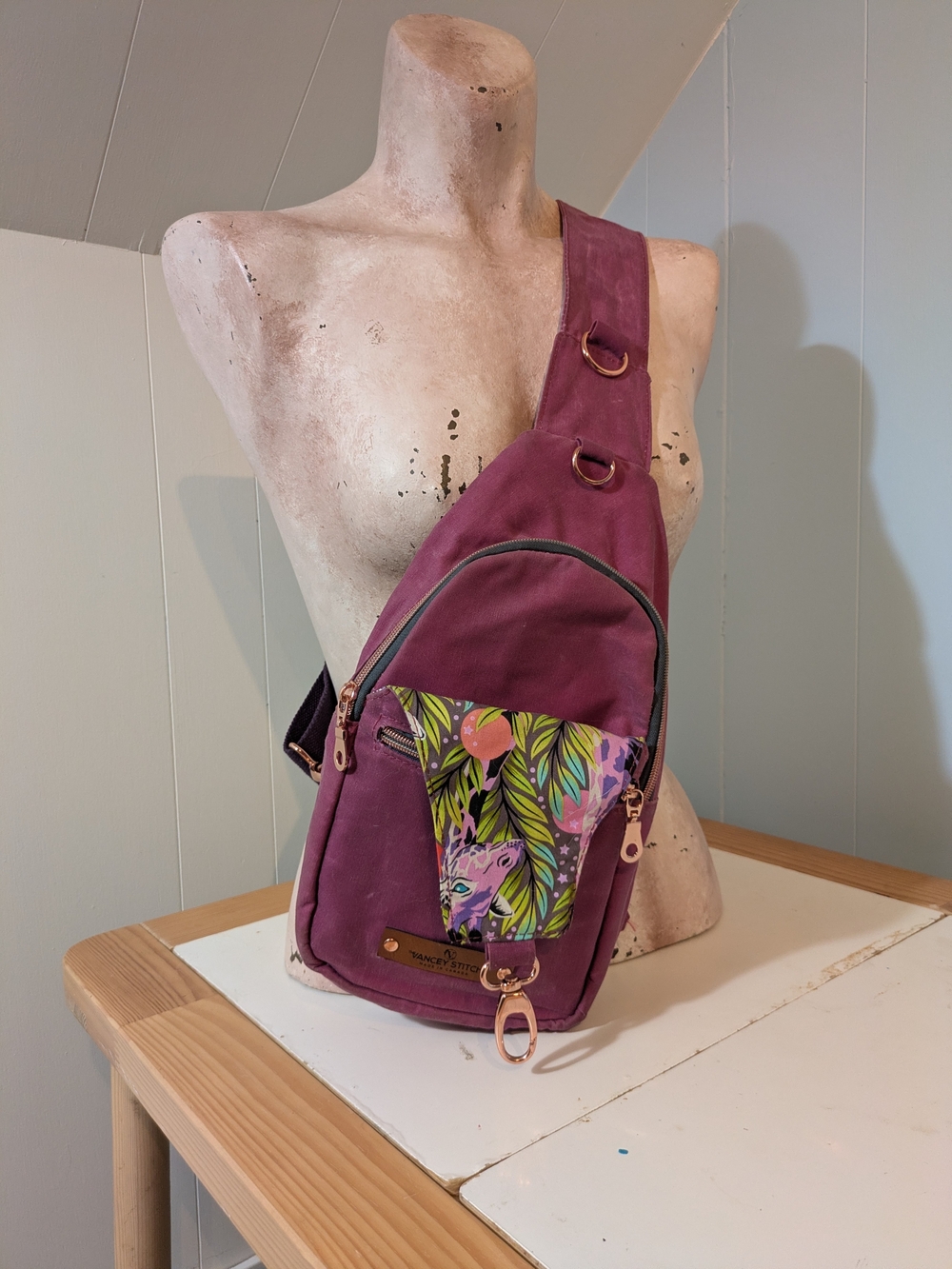 Cancel Stitch Canvas Sling Bag in Plum with Vibrant Accent